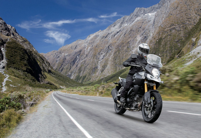 Man motorcycle curvy road mountains free wallpaper for desktop - medium preview image