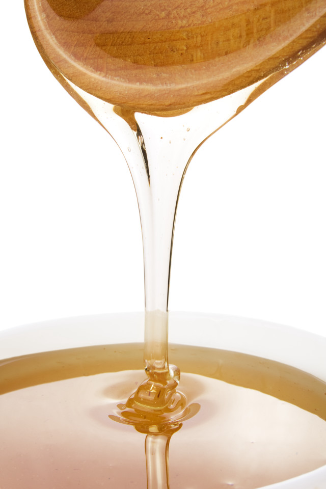 Wooden spoon pouring liquid bowl free wallpaper for mobile - medium preview image
