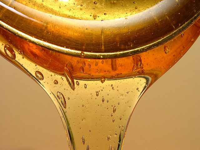 Liquid droplet gold base brown free wallpaper for desktop - medium preview image
