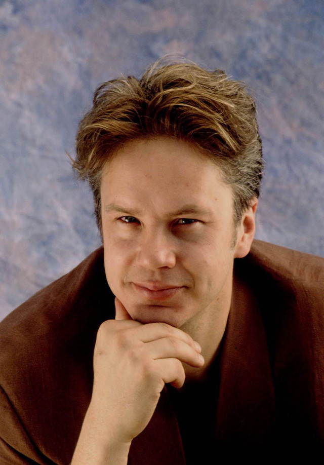 Man brown shirt jacket posing free wallpaper for mobile - medium preview image