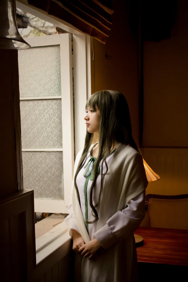 Woman standing window looking out free wallpaper for mobile - medium preview image