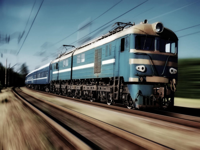 Blue train traveling tracks forest free wallpaper for desktop - medium preview image