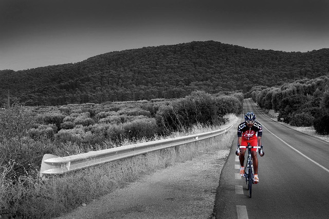 Man riding bike road green free wallpaper for desktop - medium preview image