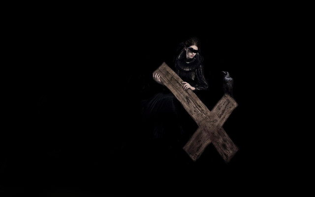Woman black dress holding cross free wallpaper for desktop - medium preview image