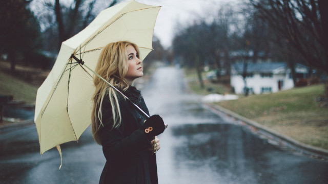 Woman holding umbrella rainy day free wallpaper for desktop - medium preview image
