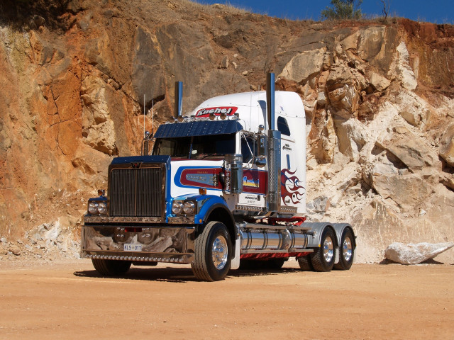 Semi truck rocky cliff mountain free wallpaper for desktop - medium preview image