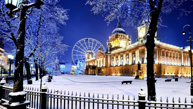 Snowy cityscape ferriswheel night bridge free wallpaper for desktop - medium preview image