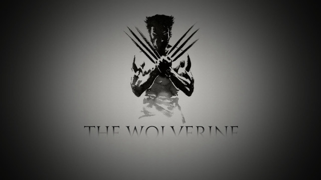 Man holding wolverine logo chest free wallpaper for desktop - medium preview image