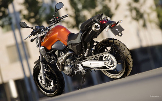 Motorcycle parked road building tree free wallpaper for desktop - medium preview image