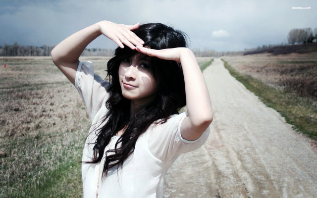 Woman standing dirt road field free wallpaper for desktop - medium preview image