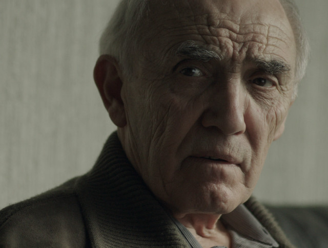 Old man serious look shoulders free wallpaper for desktop - medium preview image