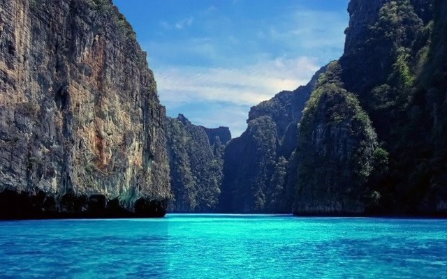 Boat mountains ocean blue sky #2 free wallpaper for desktop - medium preview image