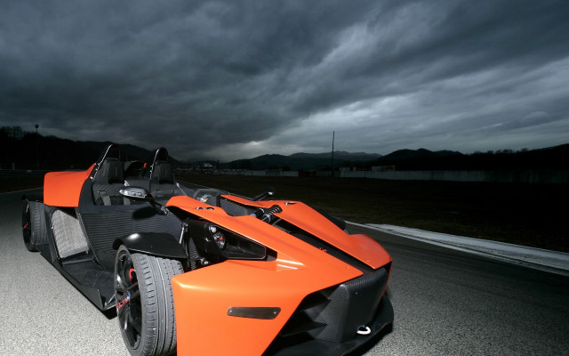 Orange car stormy sky matte free wallpaper for desktop - medium preview image