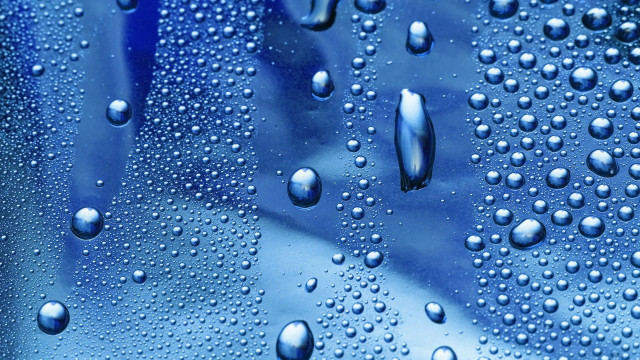 Water droplets blue surface background free wallpaper for desktop - medium preview image