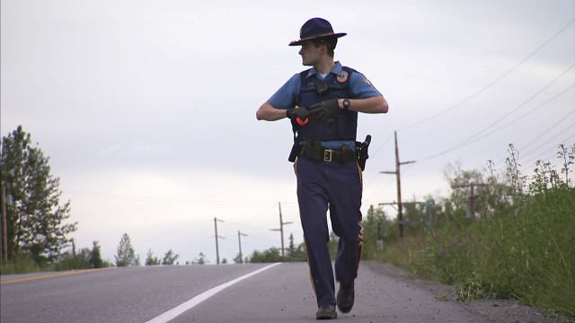 Police officer running road gun free wallpaper for desktop - medium preview image