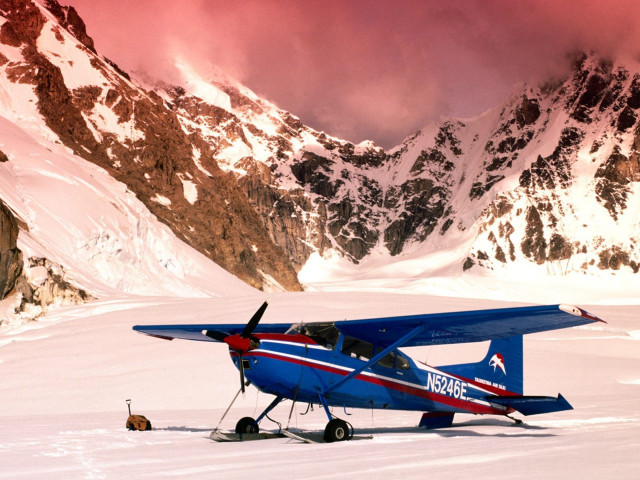 Blue airplane snowy field mountain free wallpaper for desktop - medium preview image