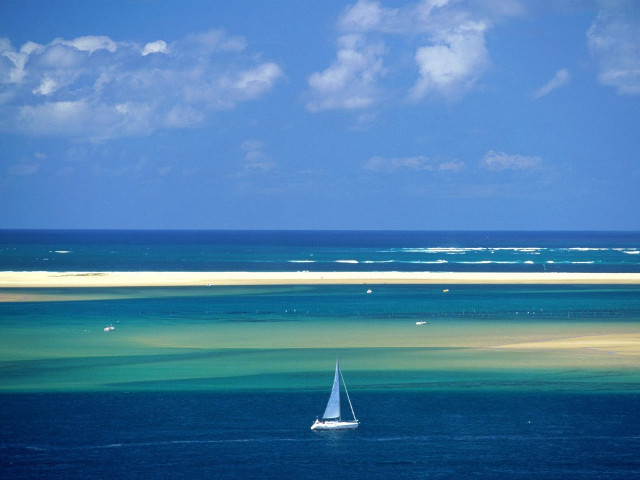 Sailboat floating ocean sky background free wallpaper for desktop - medium preview image