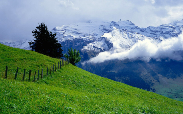 Mountain fence grassy field clouds #2 free wallpaper for desktop - medium preview image