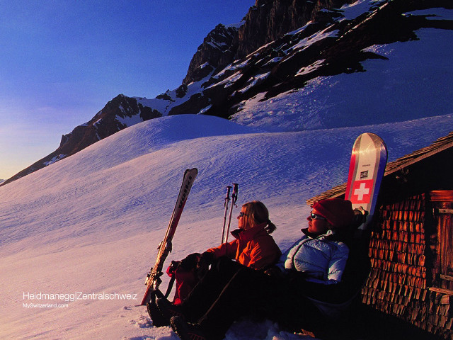 Two people sitting bench skis free wallpaper for desktop - medium preview image
