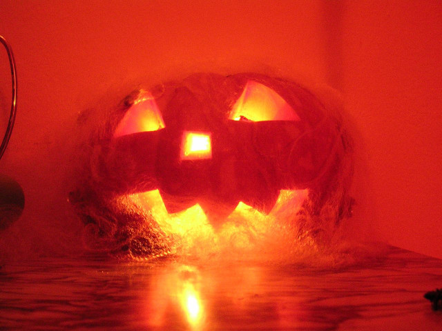 Pumpkin glowing eyes red light free wallpaper for desktop - medium preview image