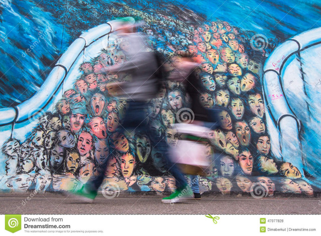 Man walking past mural large free wallpaper for desktop - medium preview image