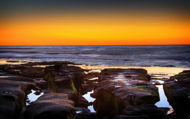 Sunset ocean rocks water orange free wallpaper for desktop - medium preview image