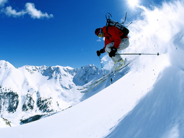 Skier mid air snowy mountain #2 free wallpaper for desktop - medium preview image