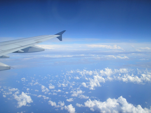 Airplane wing sky clouds water free wallpaper for desktop - medium preview image