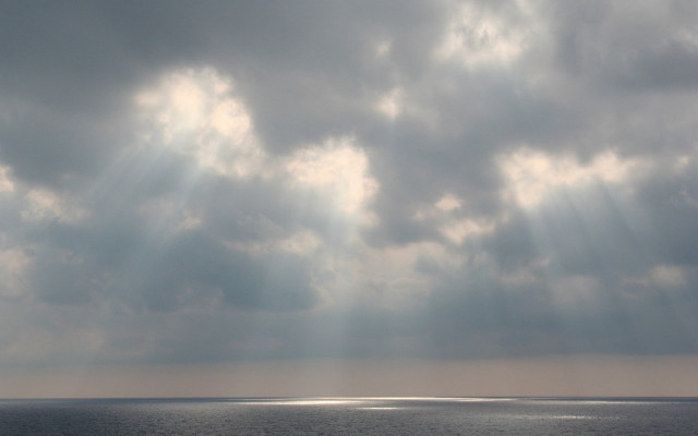 Boat ocean cloudy sky sunbeams #2 free wallpaper for desktop - medium preview image