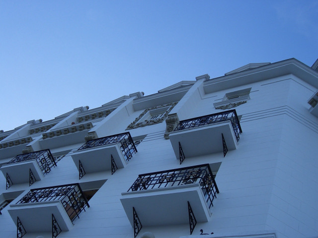 Building windows balconies sky background free wallpaper for desktop - medium preview image