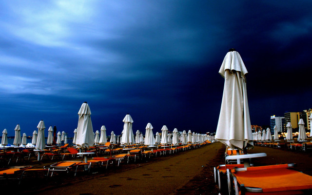 Beach chairs umbrellas cloudy night #3 free wallpaper for desktop - medium preview image