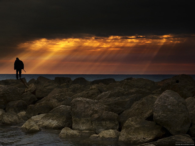 Man rock formation ocean sun free wallpaper for desktop - medium preview image
