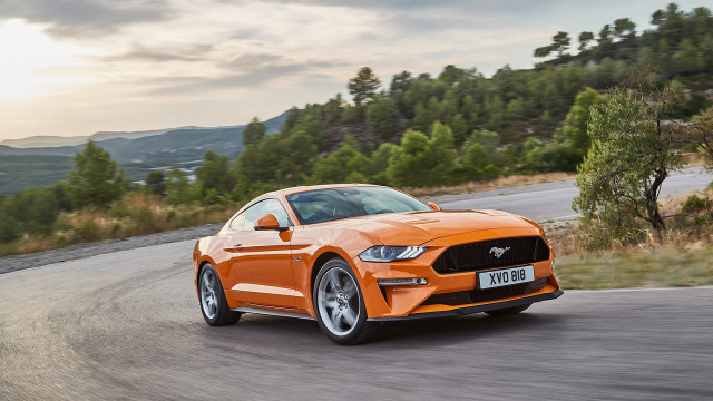 Orange mustang driving mountains trees free wallpaper for desktop - medium preview image