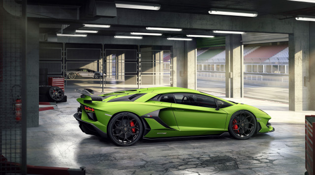 Green sports car garage motorcycle free wallpaper for desktop - medium preview image