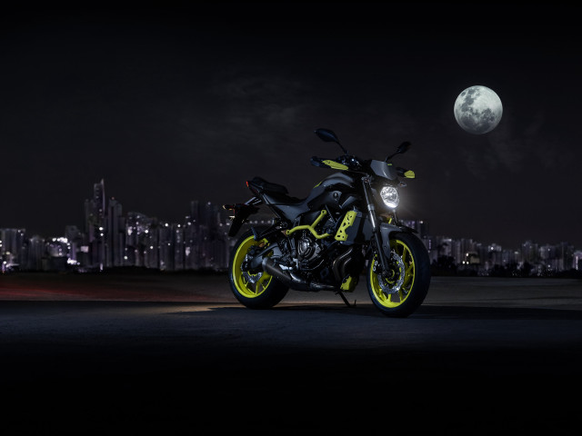 Motorcycle parked city night moon free wallpaper for desktop - medium preview image