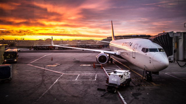 Plane parked tarmac airport sunset #3 free wallpaper for desktop - medium preview image
