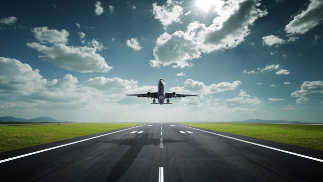 Plane flying runway sky clouds free wallpaper for desktop - medium preview image