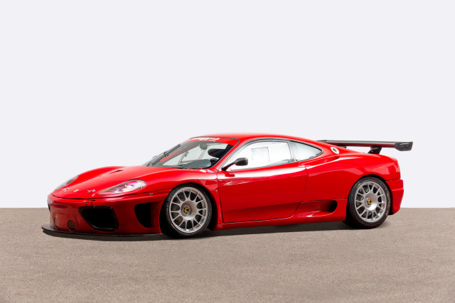 Red sports car concrete white free wallpaper for desktop - medium preview image