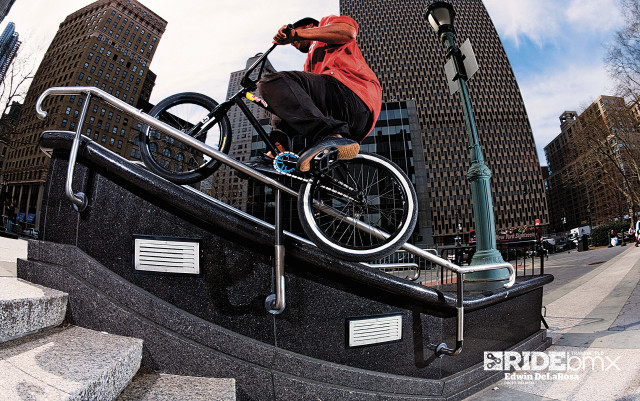 Man bike handrail streetlight building free wallpaper for desktop - medium preview image