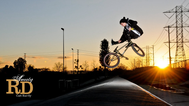 Man riding bike ramp sunset free wallpaper for desktop - medium preview image