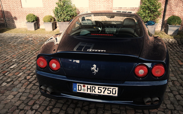 Black sports car brick building #2 free wallpaper for desktop - medium preview image