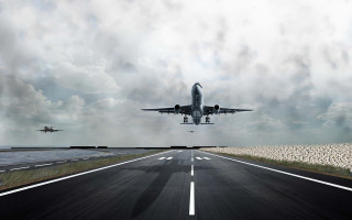 Plane flying runway cloudy sky - a plane in the distance free wallpaper