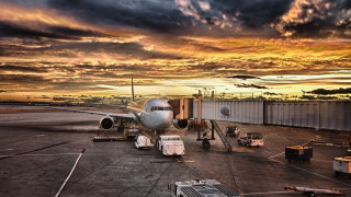 Plane parked tarmac airport sunset - the tarmac free wallpaper