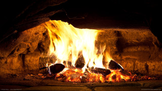 Fireplace burning rocks logs wire - a fireplace free wallpaper