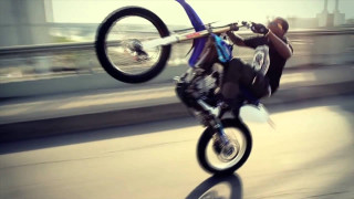 Man motorcycle trick air wheelie 2 - a bridge over water free wallpaper