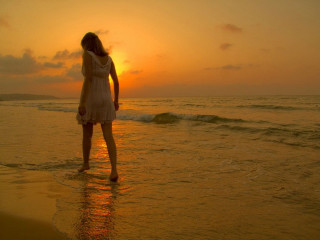 Woman standing water beach sunset - sunset time free wallpaper