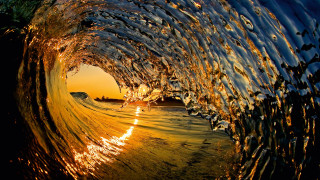 Breaking wave sunset golden water - amazing depth free wallpaper