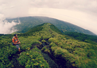 Man hiking mountain backpack clouds - ultra wide angle free wallpaper