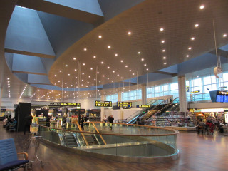 Airport long railing people walking - open ceiling free wallpaper