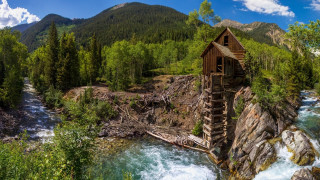 Wooden structure cliff river waterfall - a wooden structure free wallpaper